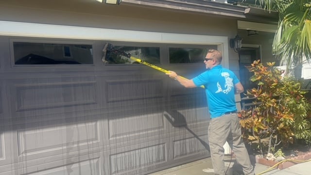 Cleaning a window in Kahului, HI